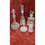A collection of glass decanters.