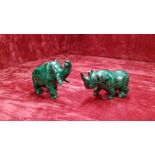 Two carved malachite animals.