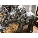 A silvered resin figure of a mature elephant 32cm tall.