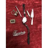 An assortment of silver and white precious metal collectables.