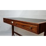 A stunning individual hand made TAM WHITEHEAD leather inset two drawer desk.