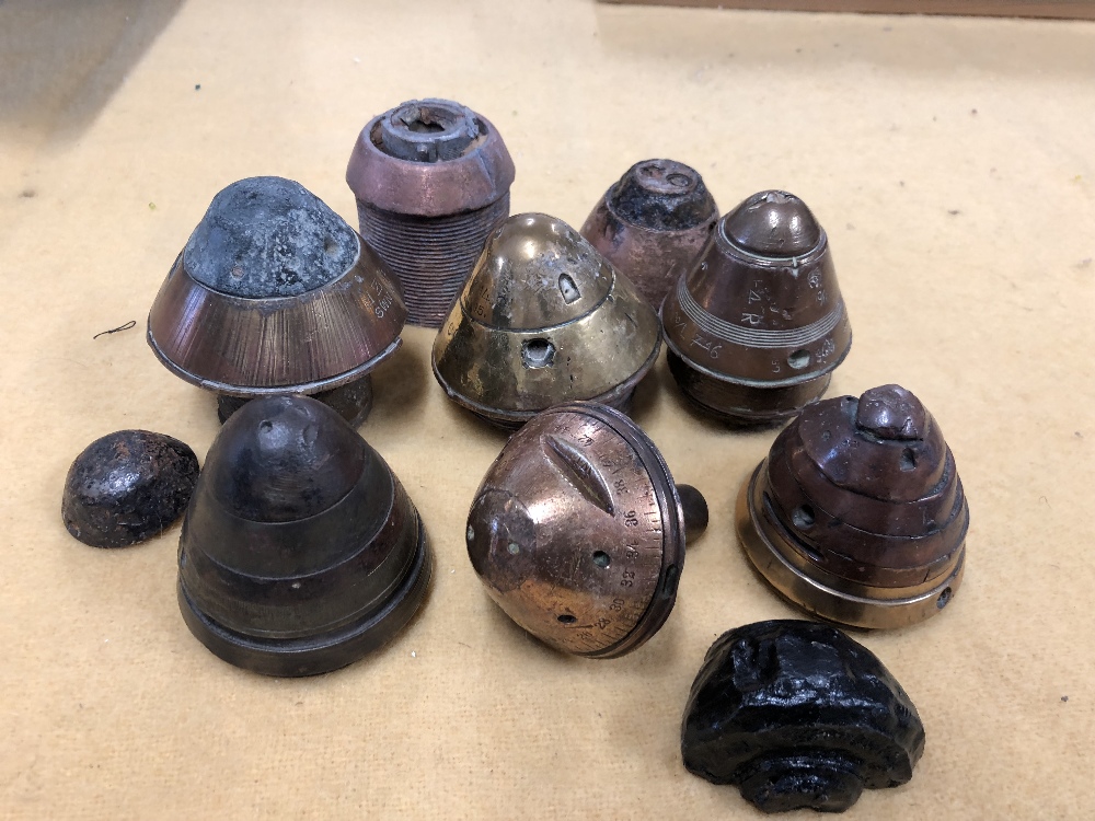 An assortment of 10 WW1 British and German artillery shell fuses.