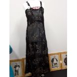 A 1920’s/30’s fitted long crepe dress with hand painted butterfly design.