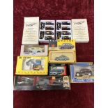 A box of assorted die-cast models.