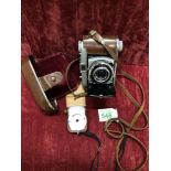 A Kodak Retina 1b camera and vintage Etalon Automat-A light exposure meter.