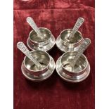 A collection of four Egyptian silver salts and spoons.
