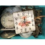 A box of vintage clock parts.