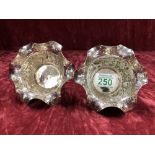 A pair of Egyptian style embossed white metal bowls.