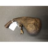 An early 19th Century powder keg made from a camel's scrotum.