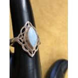 A silver Art Deco style ring with central opalite panel.
