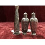 Three embossed Indian white metal perfume bottles.