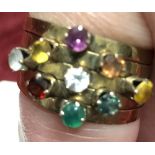 An unusual gold ring set with nine old cut stones.