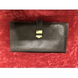 A vintage HERMES Paris black leather lady's purse.