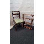 A set of wall shelves and a single 19th Century chair.