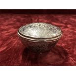 An Afghanistan white metal round trinket box.