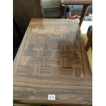 A fine individual hand made TAM WHITEHEAD pull out dining table with extra leaf.