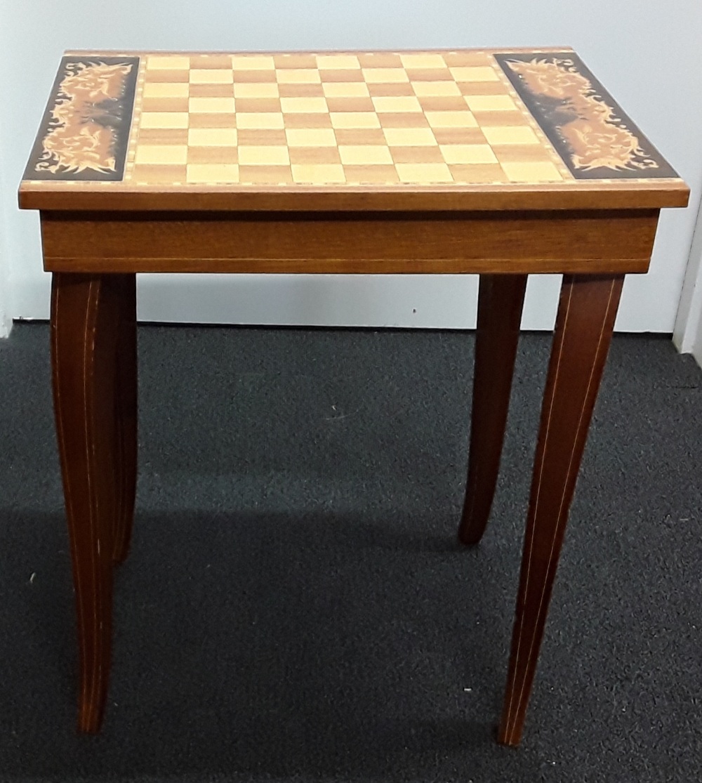 A small mahogany musical chess table.