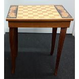 A small mahogany musical chess table.