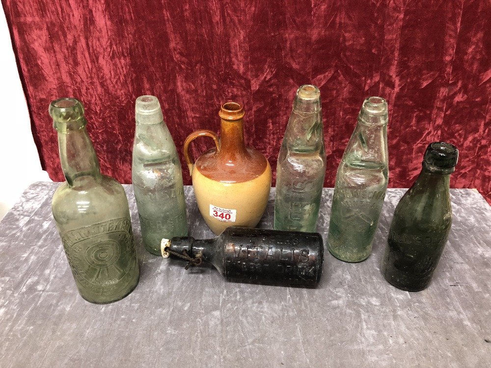 A box of collectors glass bottles of various types.