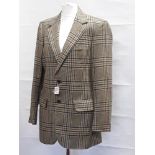 A woman's herringbone, tweed, country jacket.