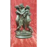 A cast bronze group of three naked females, unsigned.