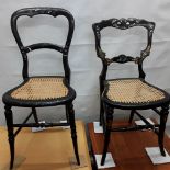 Two bedroom chairs in black wood with mother of pearl inlay.