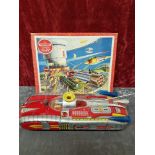 A battery operated original tin plate space car plus a Victory space jigsaw.