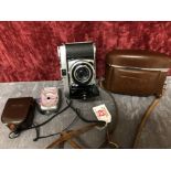 A Kodak Retina 1b camera and vintage Etalon Automat-A light exposure meter.