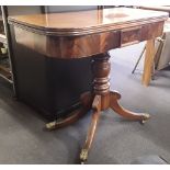 An early to mid 19th Century mahogany card table with revolving opening top.
