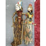 A pair of vintage Wayang Golek original wood rod puppets from Indonesia.