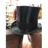 A silk top hat by Scott & Co. with leather case.