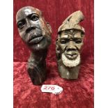 Two African marble / granite busts of a native African man and woman.