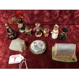 A collection of small porcelain figures and a collection of pill pots.