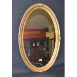 An Oval Gilt Framed Wall Mirror