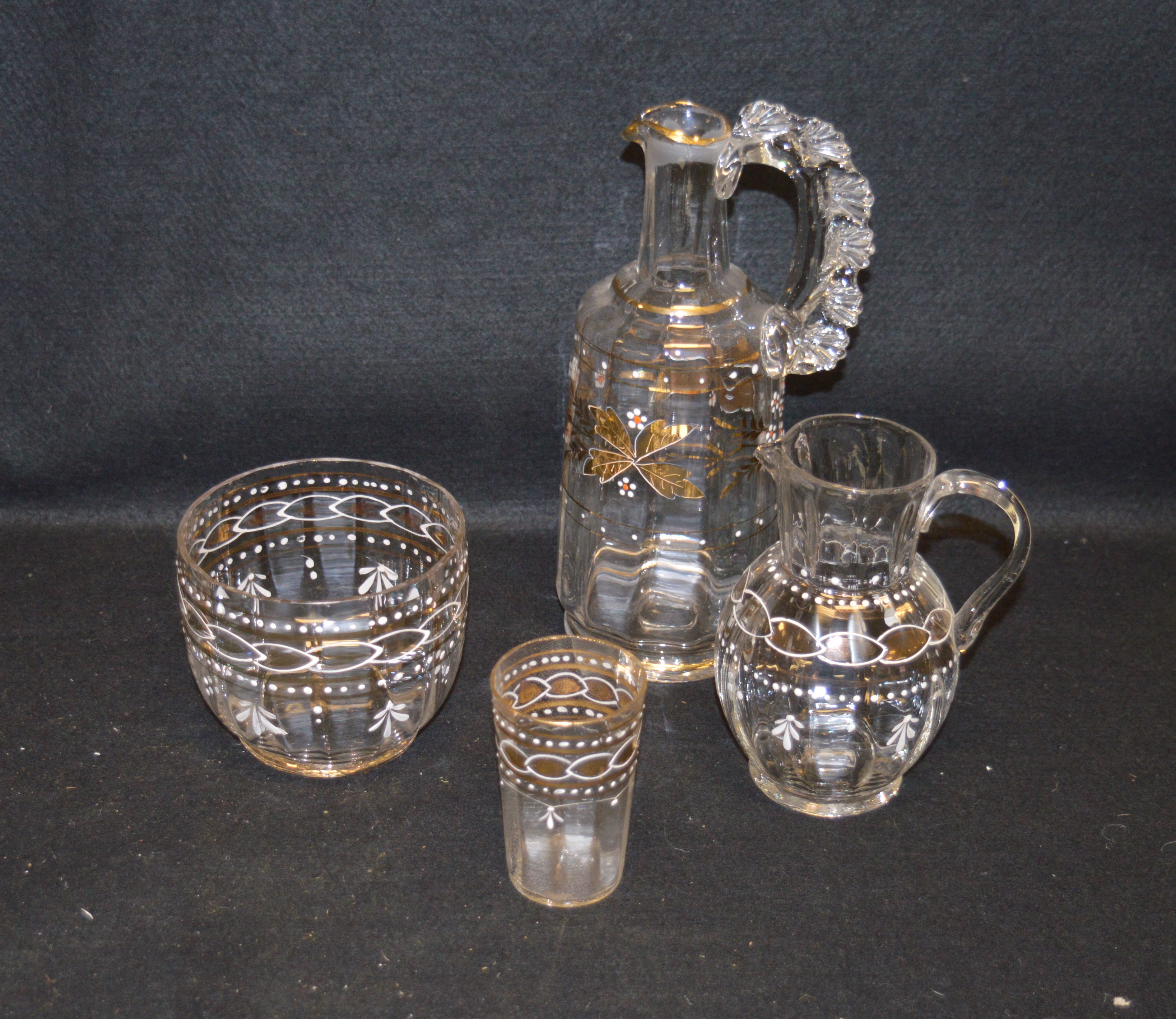 A Collection of Four Pieces of Hand Painted Crystal Including a Lidded Decanter