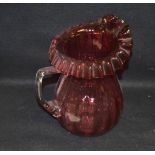 A Large Ruby Glass Jug