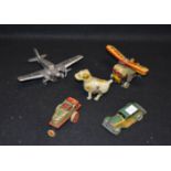 A Very Nice Lot of Two Old Aeroplanes and Three Wind Up Toys