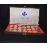 A Very Good Cased Set of 28 Silver Mounted Canadian 1976 Olympic Coins