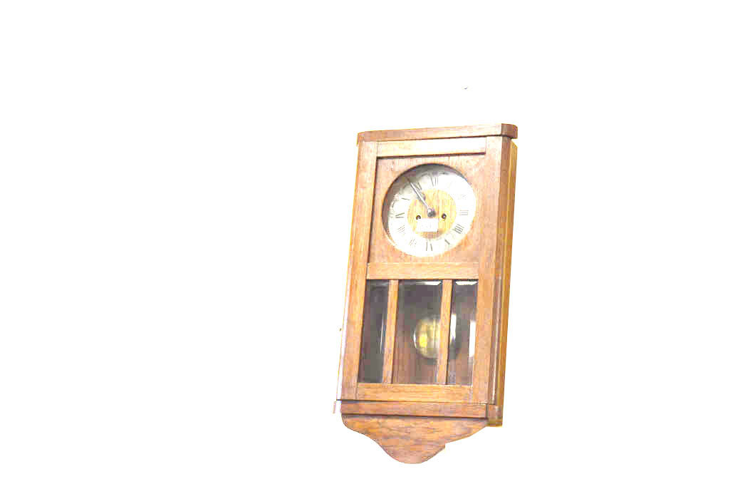 An Oak Cased Wall Clock