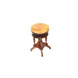 A Circular Mahogany Leather Covered Piano Stool