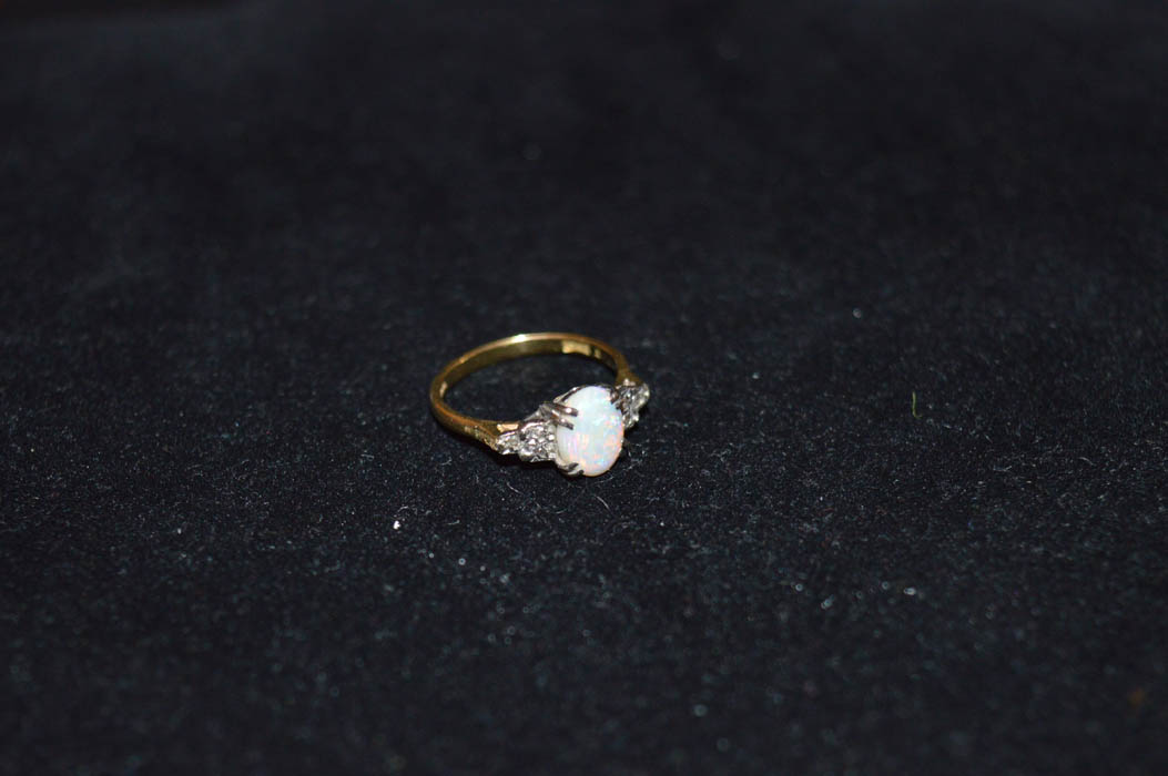 An 18ct Gold Opal and Diamond Ring