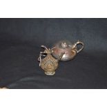 An Unusual Oriental Style Oil Can and a Silver Plated Teapot