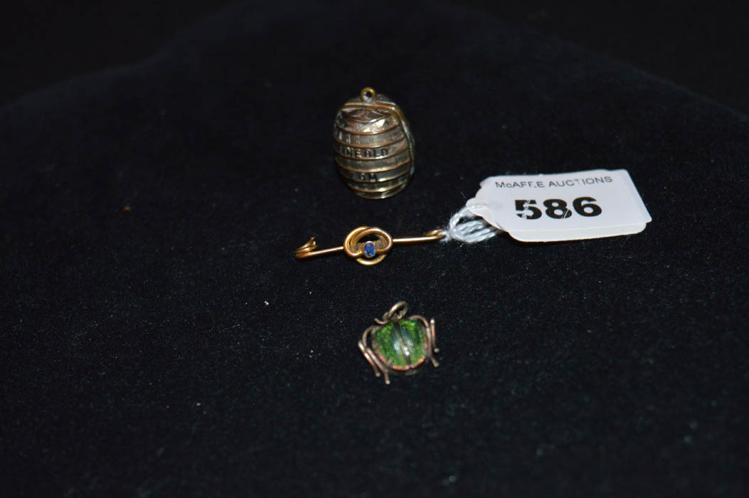 A 9ct Gold Brooch, A Rolled Gold Barrell and a Pendant