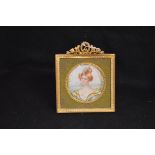 A Gilt Framed Circular Miniature 'Young Lady'