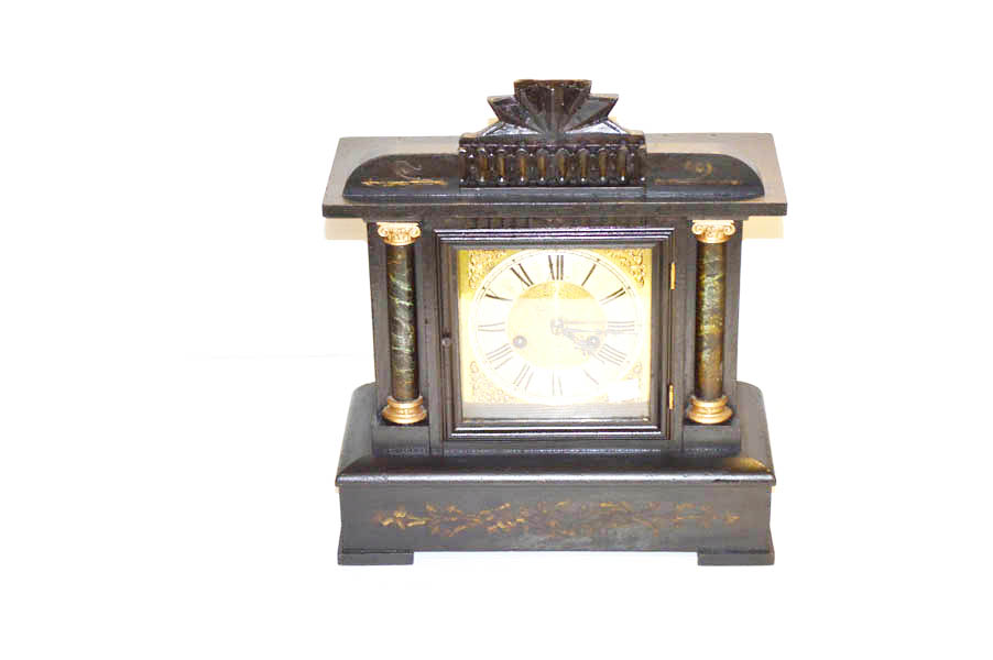 A Wooden Cased Two Pillar Mantle Clock