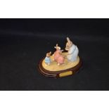 A Beswick Figurine 'Mrs Rabbit and the Four Bunnies'