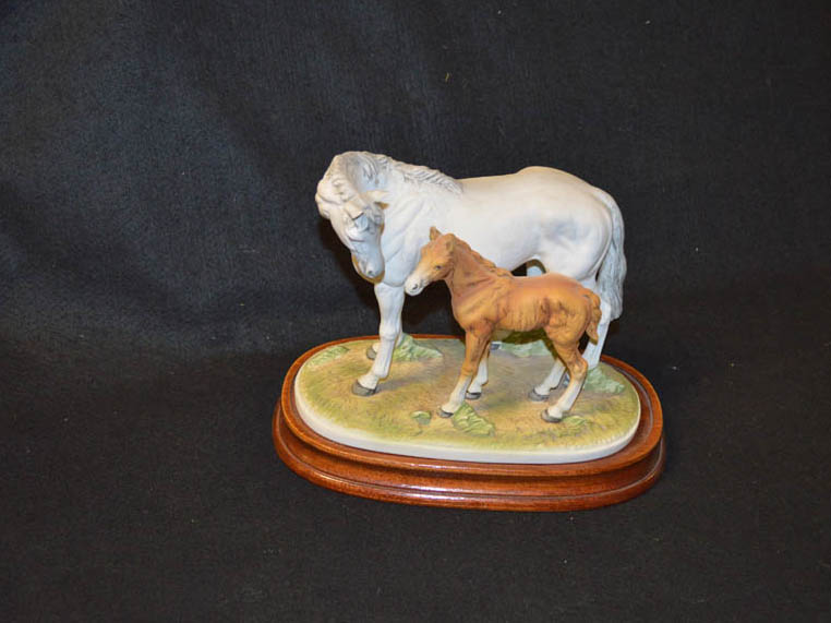 A Porcelain Figurine of a Horse and Foal