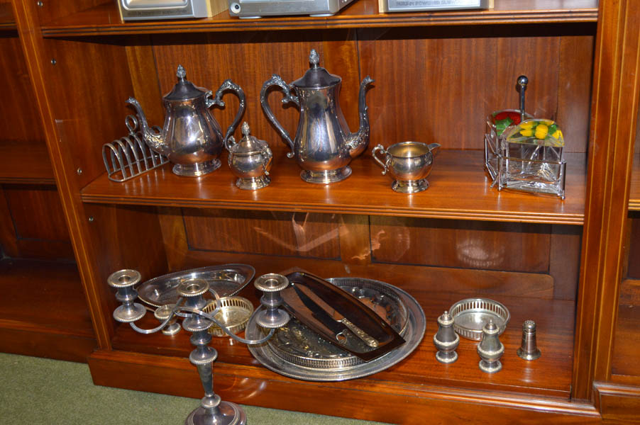 A Large Collection of Silver Plate, Two Shelves