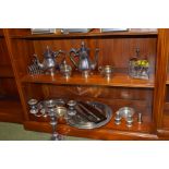 A Large Collection of Silver Plate, Two Shelves