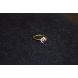 An 18ct Gold and Platinum Ruby and Diamond Cluster Ring